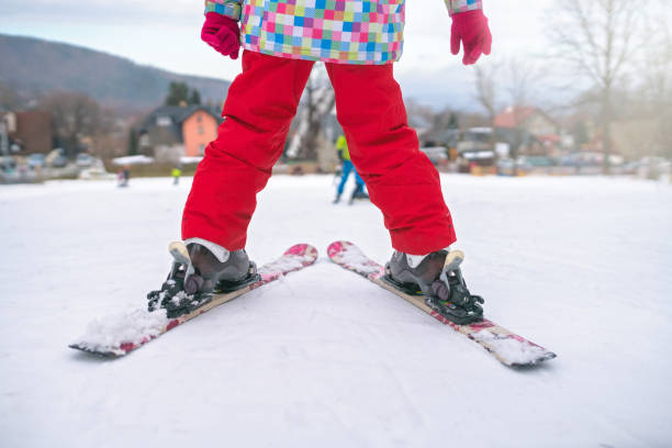 istock Little girl preparing to ski downhill 1047142930