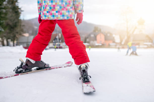 Little girl preparing to ski downhill