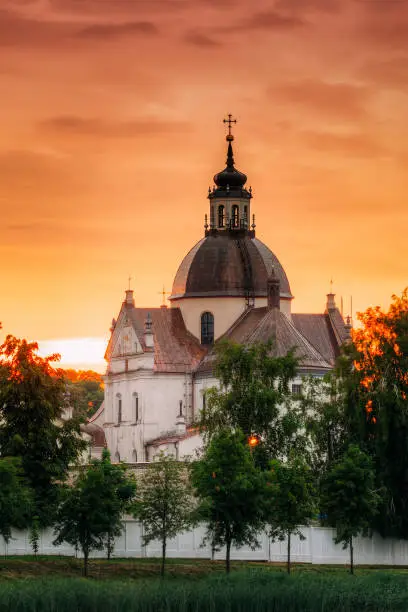 Photo of Nesvizh, Minsk Region, Belarus. Corpus Christi Church In Summer Sunset Evening. Famous Landmark
