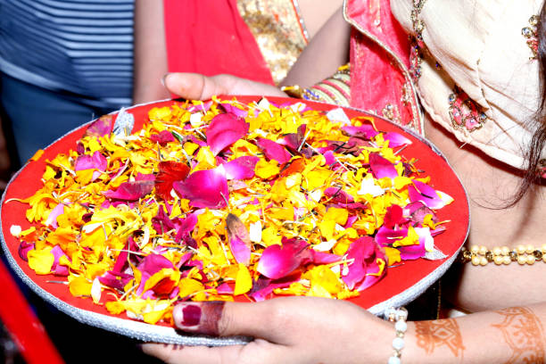 istock Indian bridesmaid wedding baraat welcome ritual ceremony 1047147056