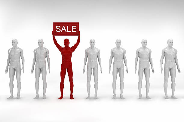 Miniature figurine posed as businessman looking at Sale sign tag handrawn on adhesive paper note, e-commerce concept image