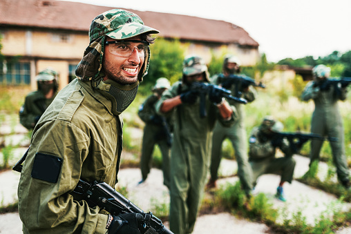 Popular warfare game with artificial - replica guns called airsoft, where players develop strategies and encourage teamwork.