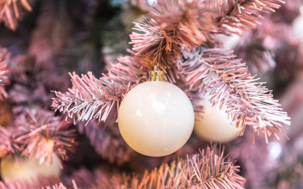 istock Pink Christmas tree with holiday decoration 1047159434