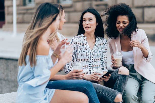 istock Multi-Ethnic Group of friends drinkig ice coffe 1047159902
