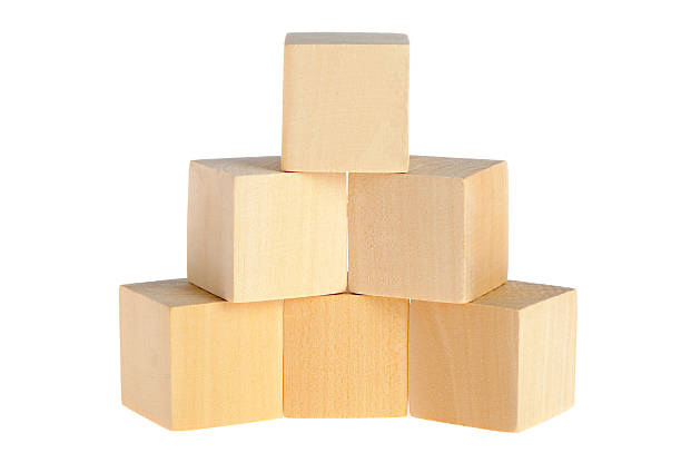 istock Wooden cube blocks stacked in a pile 104716010