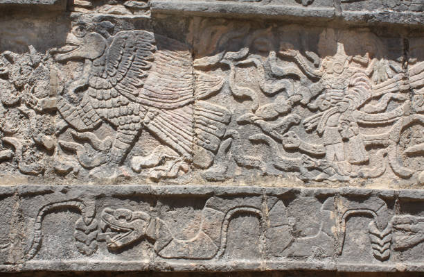 istock Bas-relief carving of eagle, chieftain and snake, Chichen Itza, Mexico 1047163206