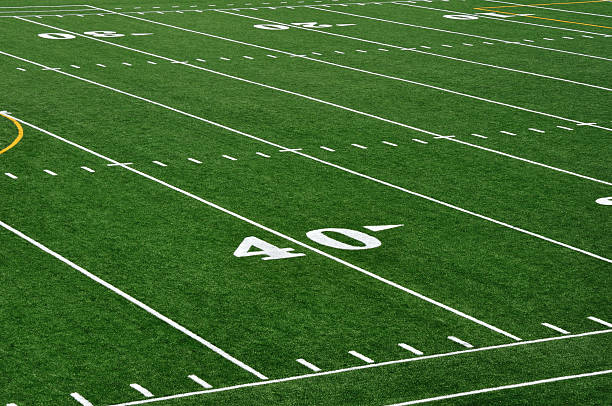Close-up of 40 yard line of American football field Forty Yard Line on American Football Field american football field photos stock pictures, royalty-free photos & images