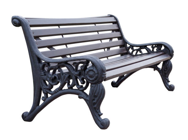istock Side view on a gray wooden bench with wrought legs with ornate patterns, isolated on a white background 1047166726