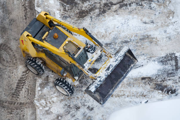 istock Top view on a snow-removing machine on a dirty street 1047166872