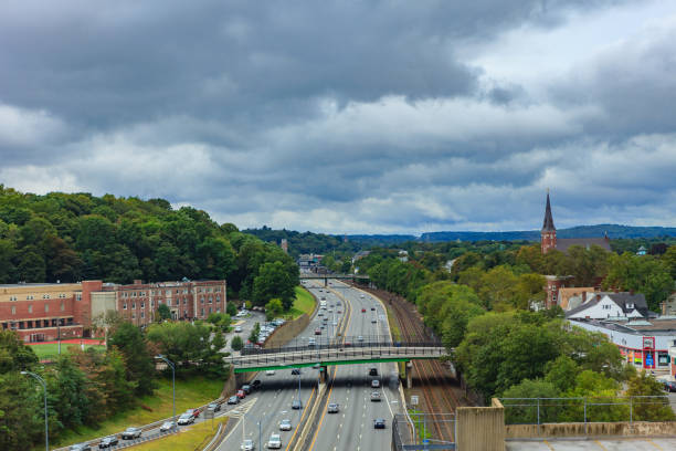 Newton MA, USA - A High Angle View Of the Massachusetts Turnpike In The Morning Sunlight On An Overcast Day stock photo