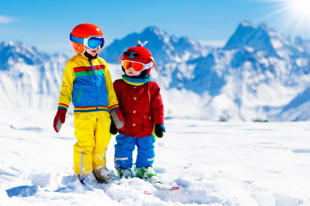 istock Ski and snow winter fun for kids. Children skiing. 1047183270