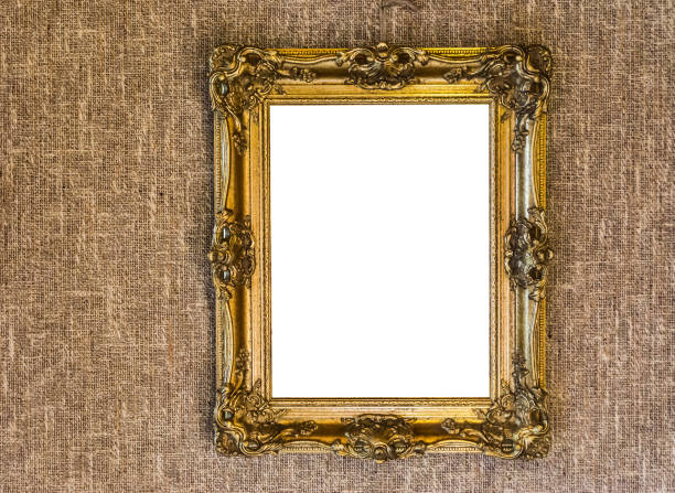 istock empty expensive looking antique golden painting frame work hanging on a jute cloth wall background 1047183956