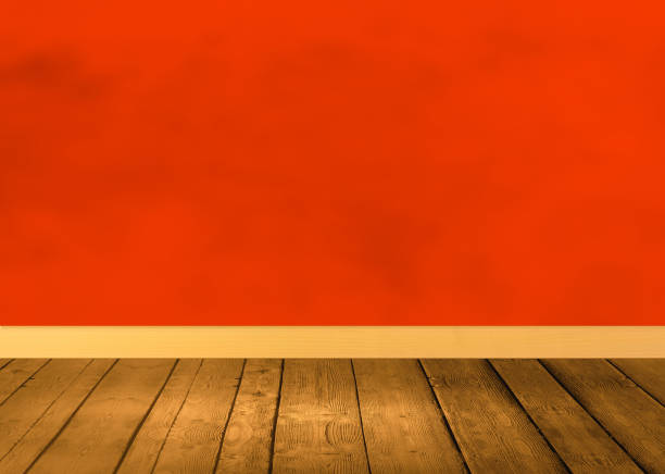 istock Wooden floor with red wall 1047187048