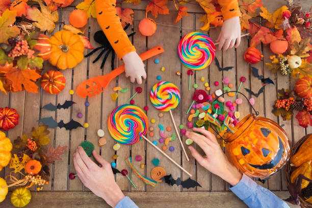 istock Halloween trick or treat candy and pumpkin. 1047189632