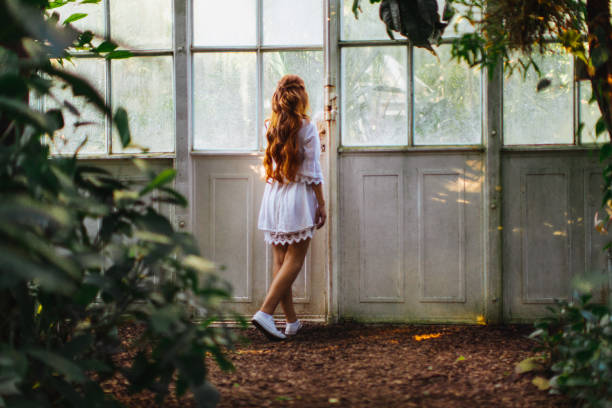 Dreamy woman in tropical environment