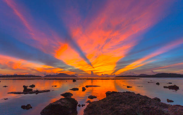 istock reflection of beautiful sunrise in Rawai sea 1047196978