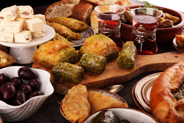istock Middle eastern or arabic dishes and assorted meze, concrete rustic background. sambusak. Turkish Dessert Baklava with pistachio. Sarma. Halal food. Lebanese 1047197702