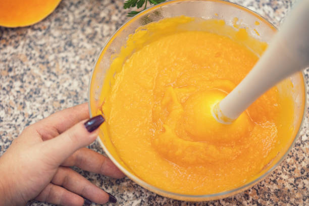 istock Preparing Pumpkin soup at home 1047202790