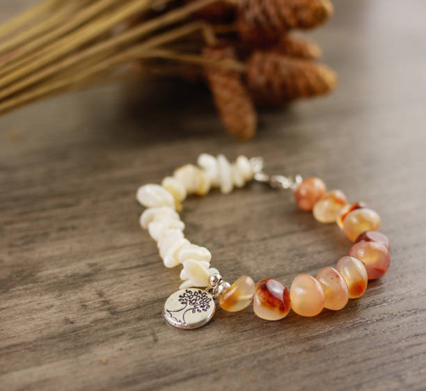 istock Bracelet on wooden table 1047203114