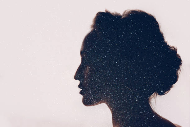 istock Girl and space. Silhouette and starry sky. 1047203674