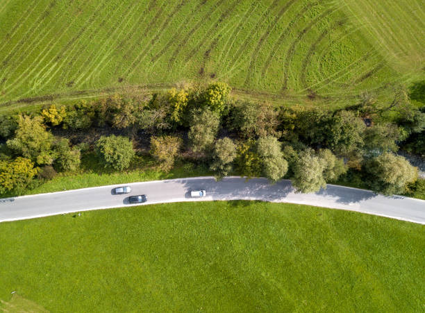 istock Road through agricultural area 1047206294