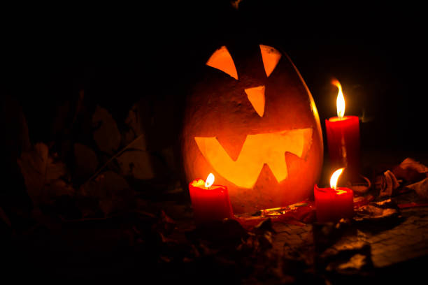 istock Halloween pumpkin at night. 1047207470