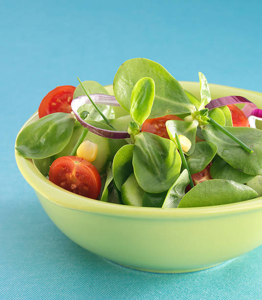 Fresh purlsey salad on blue background.
