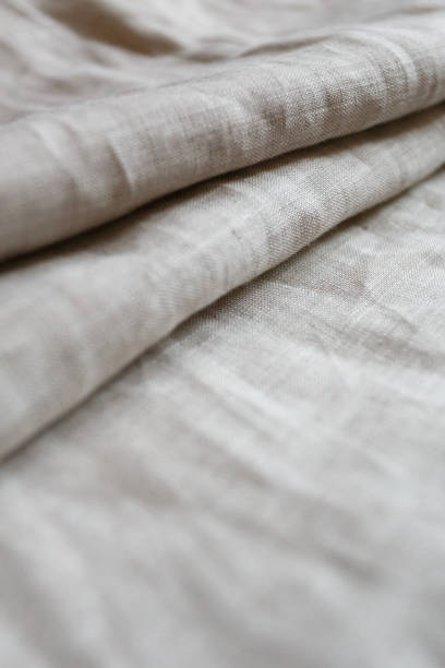 istock Natural linen cloth background close 1047213214