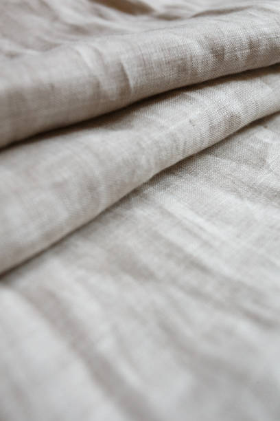 istock Natural linen cloth background close 1047213302