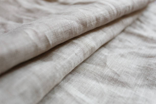 istock Natural linen cloth background close 1047213340