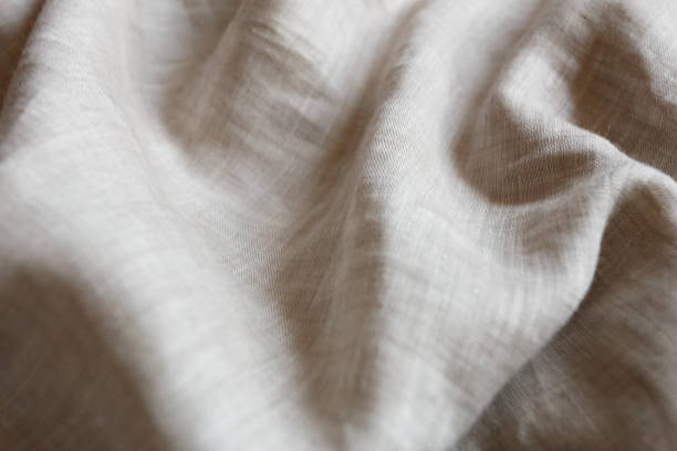 istock Natural linen cloth background close 1047213518