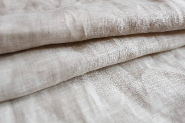 istock Natural linen cloth background close 1047213638