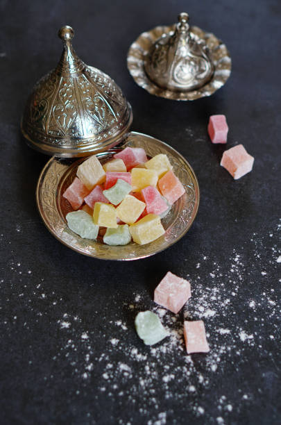 istock Traditional Turkish Delight in a plate on black background 1047213832