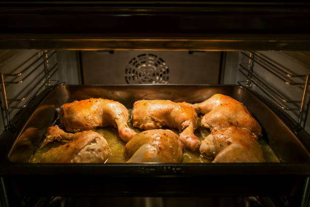 Chicken drumsticks cooked on a baking tray in the oven