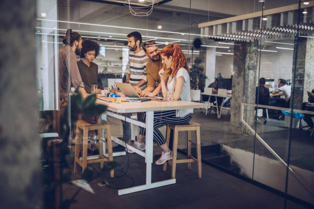 istock Team of creative people working at casual office. 1047227278