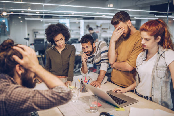 Group of worried freelance workers having problems in the office.