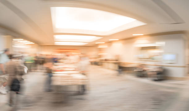 istock Panoramic view blurry background multiethnic people at breakfast of workshop event in USA 1047230266