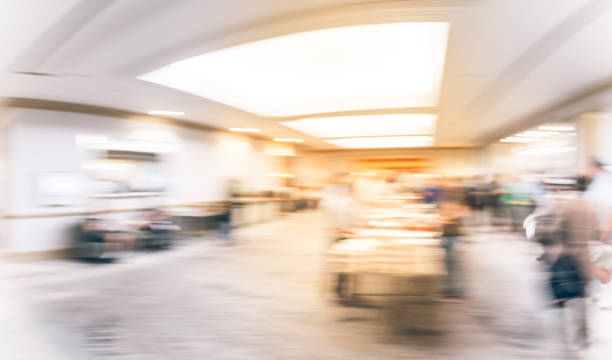 istock Panoramic view blurry background multiethnic people at breakfast of workshop event in USA 1047230302