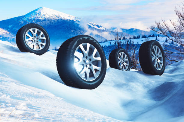 istock Car wheels with offroad winter tyres on snow 1047259408