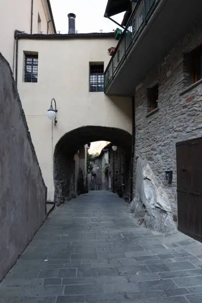 Photo of Alley in the mountain village in Bard, vertical image
