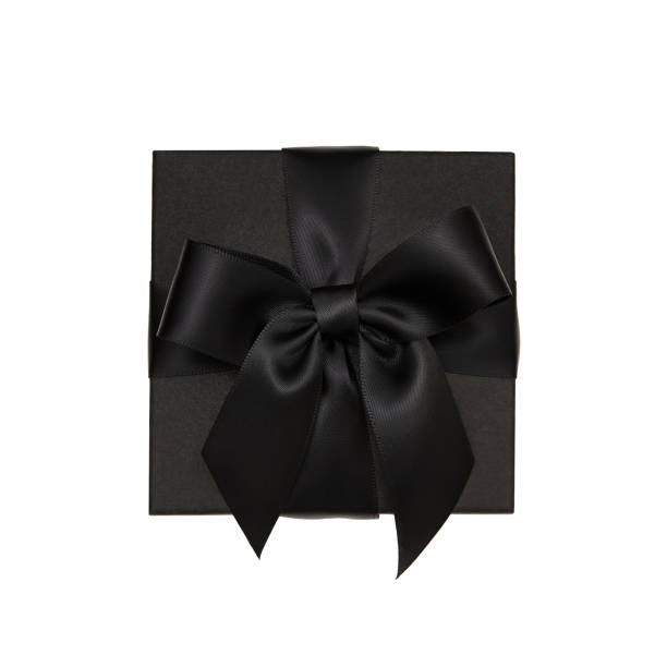 istock Black gift isolated on white background, silk ribbon bow 1047282912