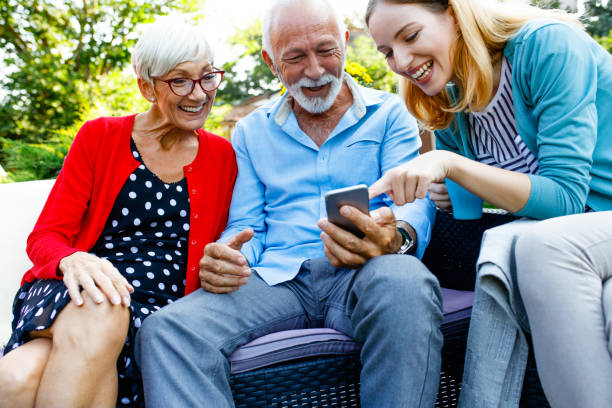 istock Daughter and elderly parents talking and drinking coffee 1047283108