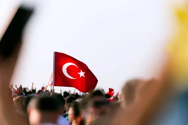 September 9 Independence day of Izmir. Crowded people in the square of Gundogdu and a Turkish flag in crowded people.