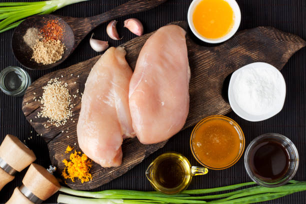 ingredientes para pollo en salsa de naranja - skinless chicken breast fotografías e imágenes de stock