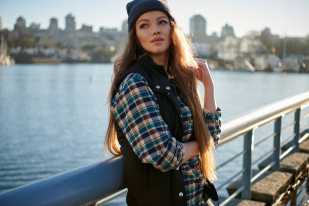 istock Young beautiful woman walking in downtown 1047322270