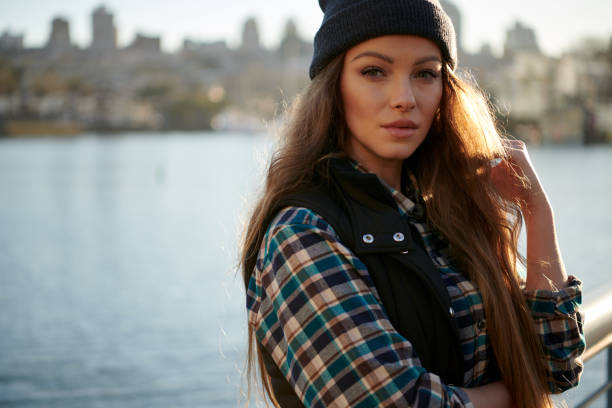 istock Young beautiful woman walking in downtown 1047322484