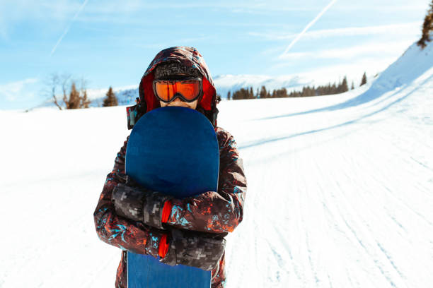 istock Female snowboarder having fun on ski track 1047330168