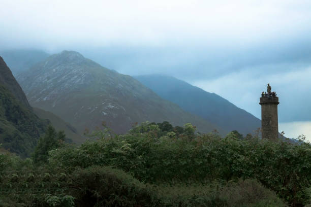 Glenfinnan Monument, Highland, Scotland. Glenfinnan, Lochaber, Scotland, UK - August 2, 2016: Glenfinnan Monument at Loch Shiel, scottish Highlands. Memorial of the Jacobite rising in 1745. glenfinnan monument stock pictures, royalty-free photos & images