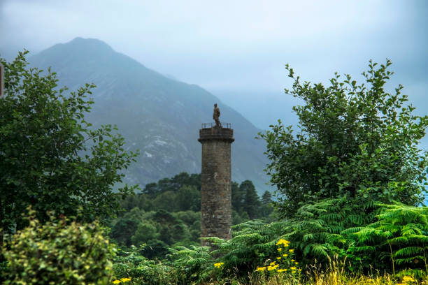 Glenfinnan Monument, Highland, Scotland. Glenfinnan, Lochaber, Scotland, UK - August 2, 2016: Glenfinnan Monument at Loch Shiel, scottish Highlands. Memorial of the Jacobite rising in 1745. glenfinnan monument stock pictures, royalty-free photos & images