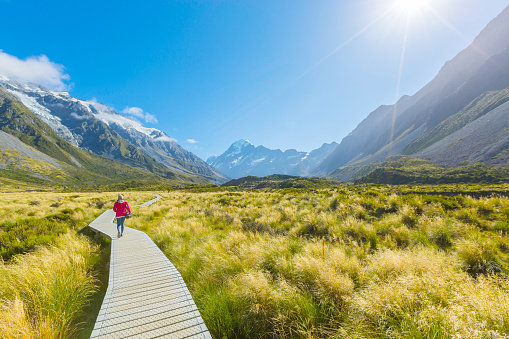 Summertime , woman enjoy travel at mount cook national park in south Island New Zealand